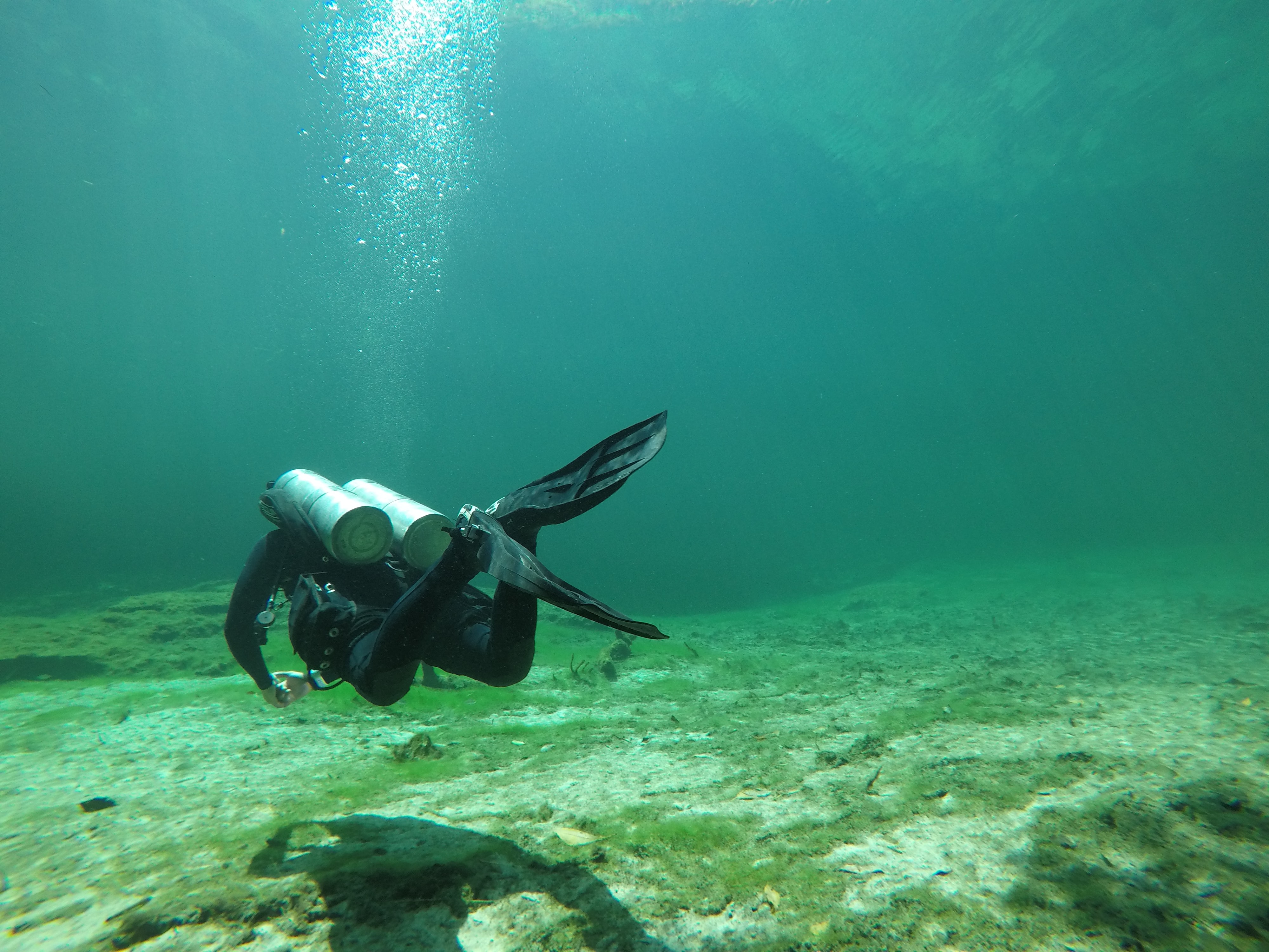 Scuba diver in Cancun exploring the underwater statues