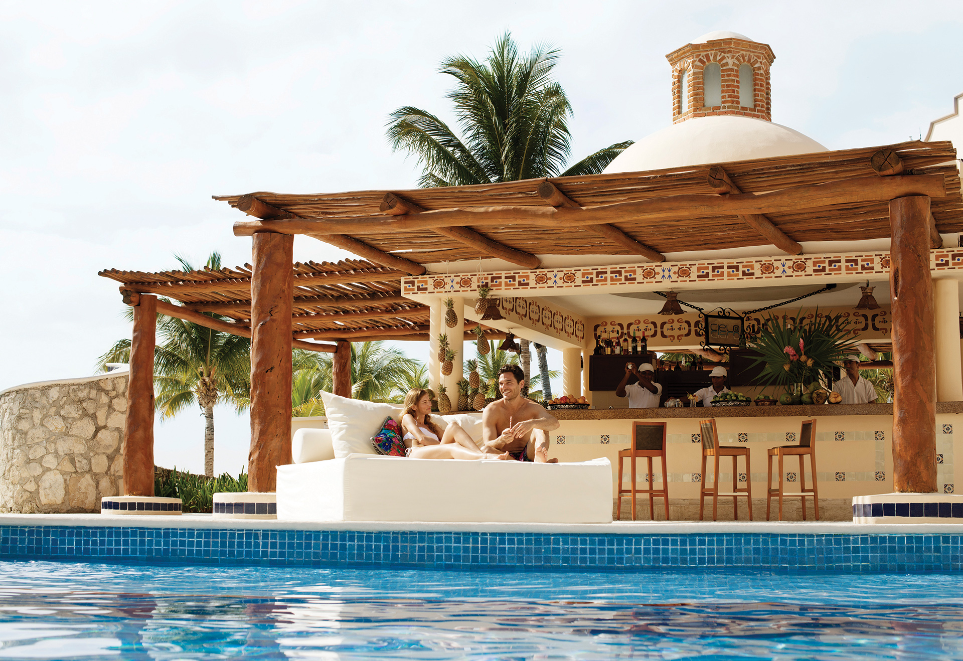 Man and woman enjoying their All Inclusive resort without worrying about money