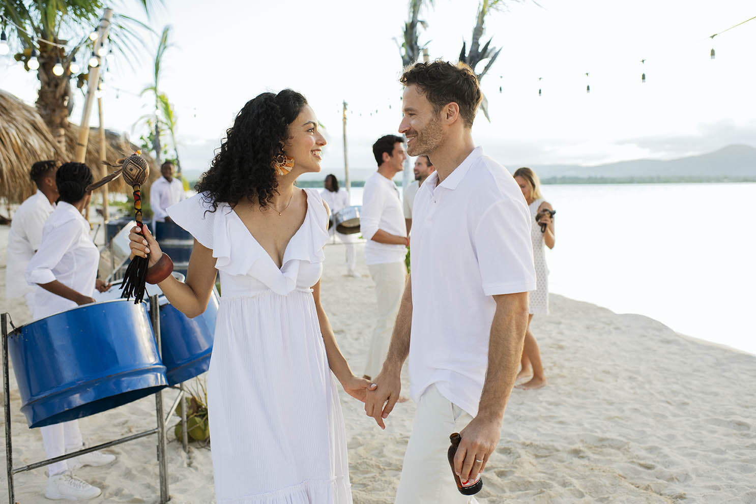 Man and woman dancing on the beach in Excellence Oyster Bay